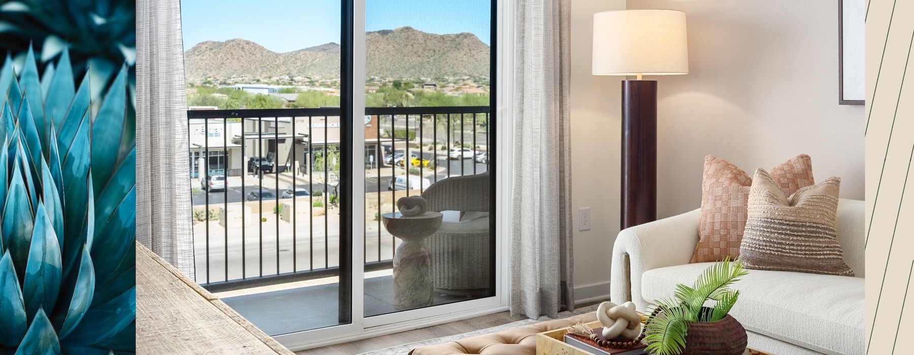 a living room with a couch and a glass sliding door
